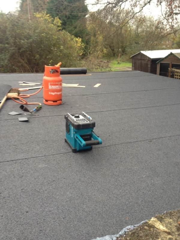 Flat roofing work with gas torch in Reading